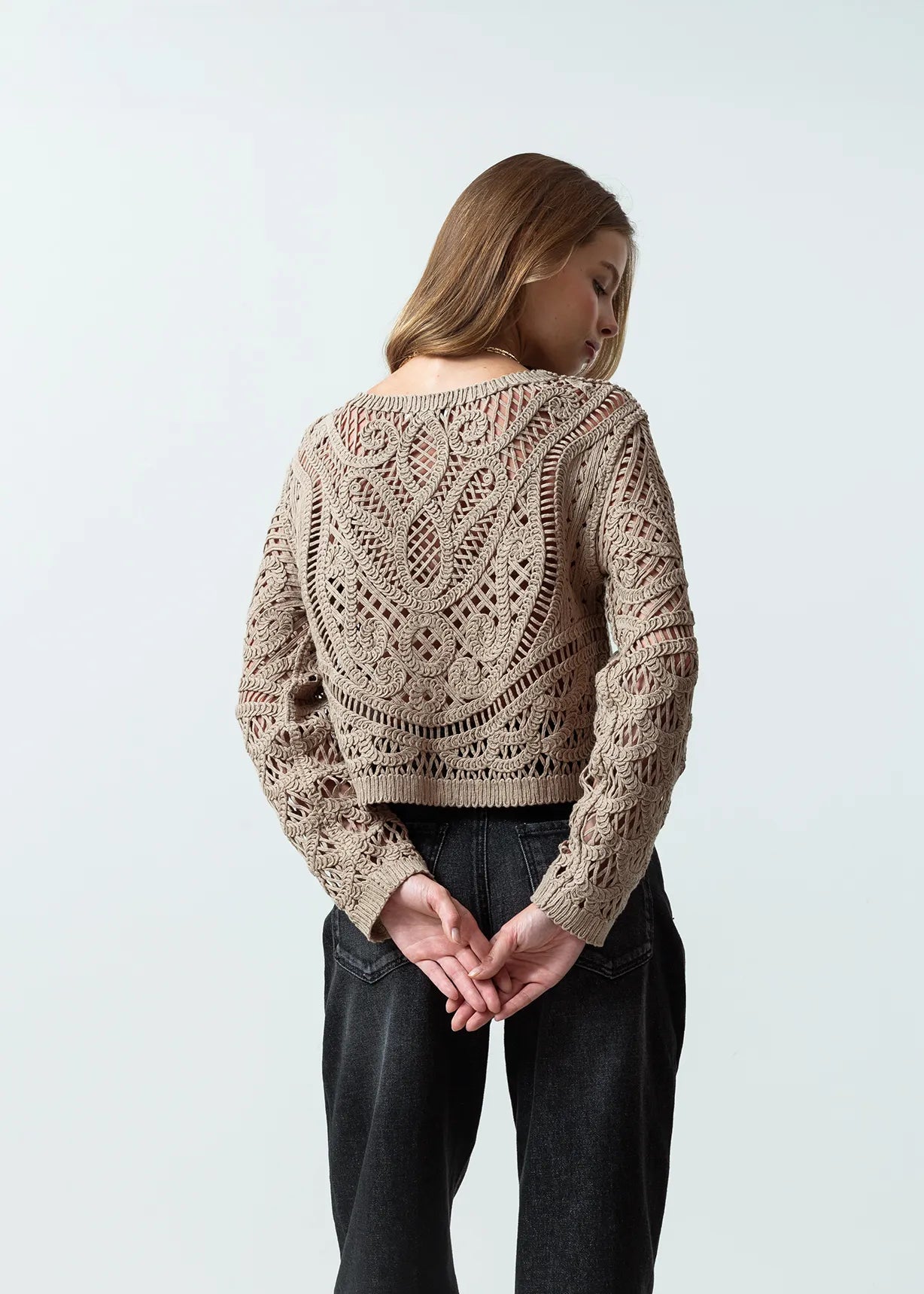 Open design woven sweater