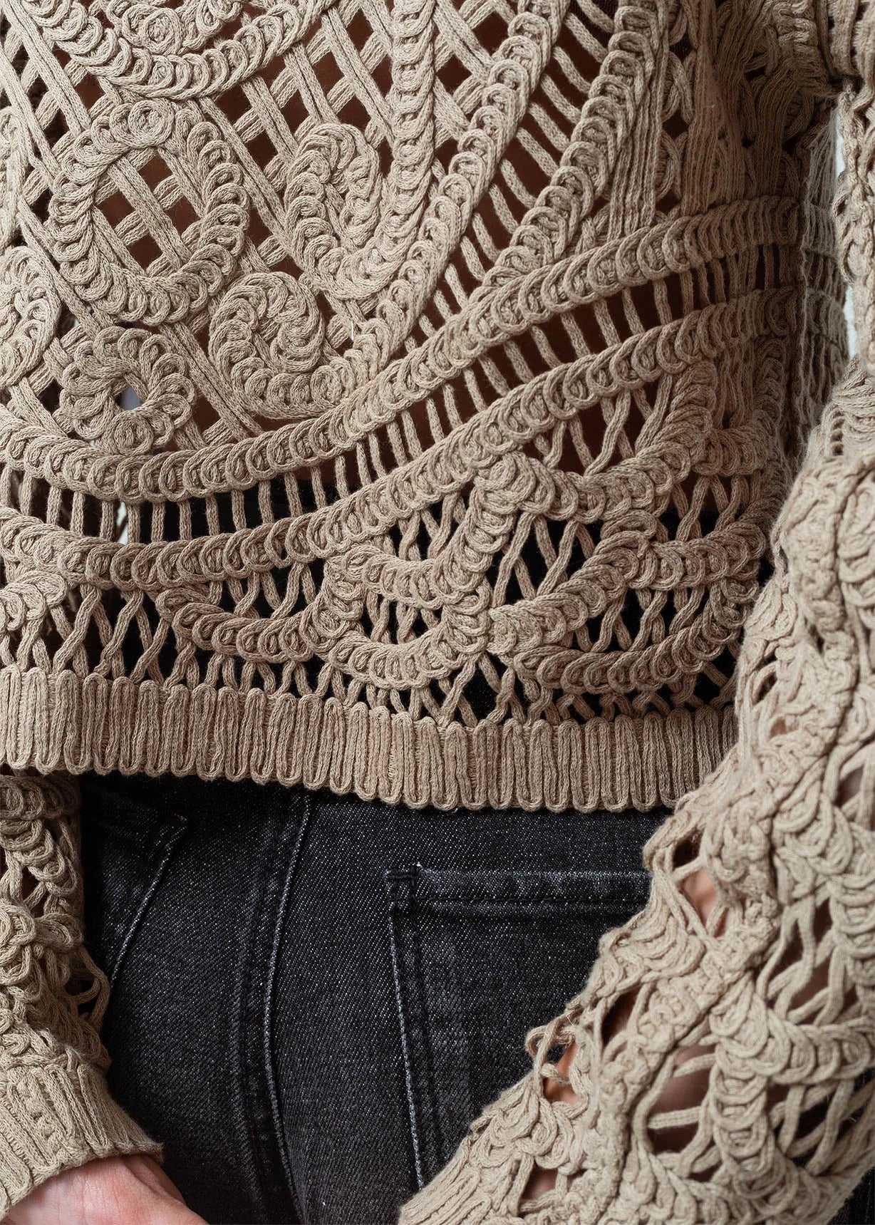 Open design woven sweater