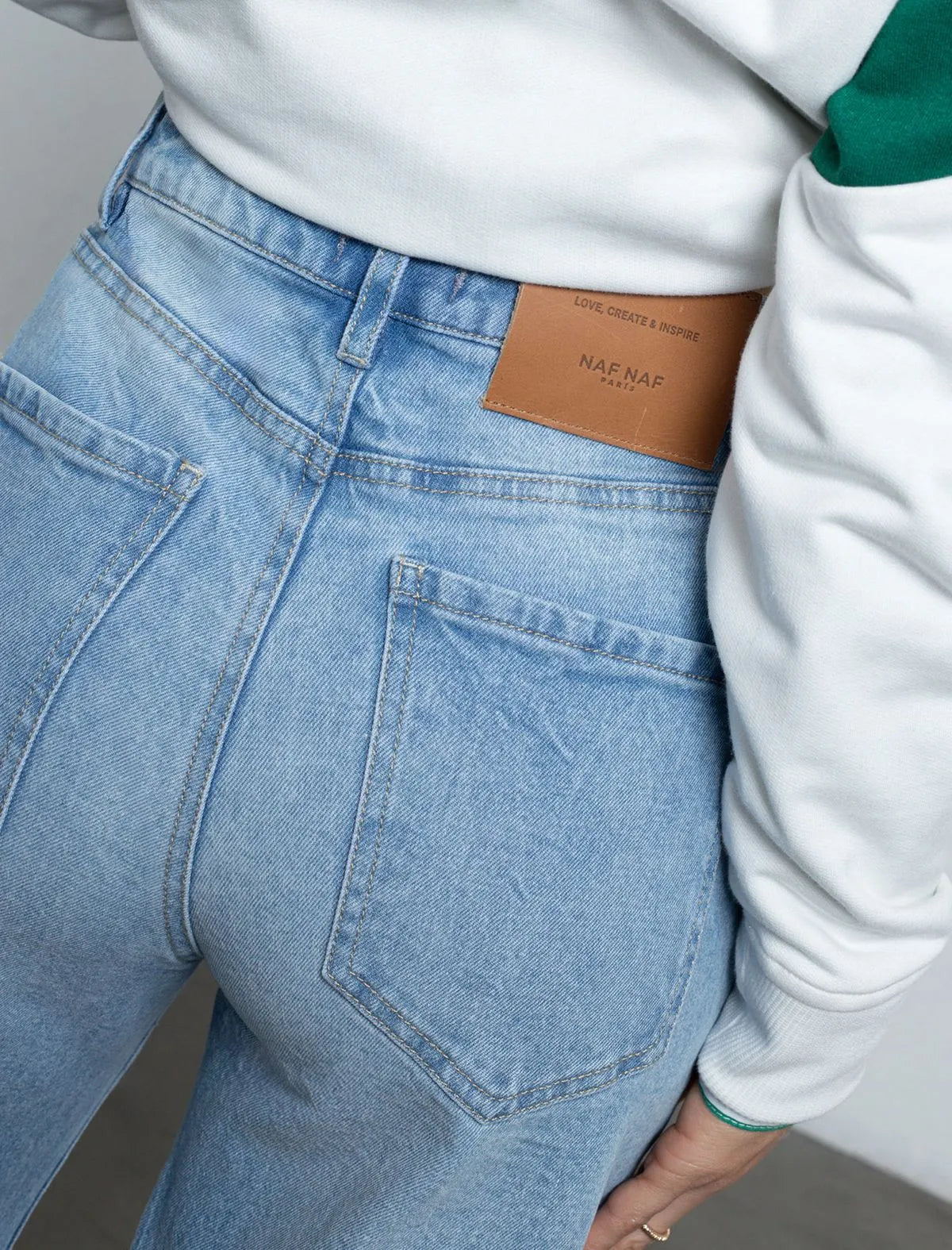 Mid-rise jean • Super high rise. • Wide leg fit.