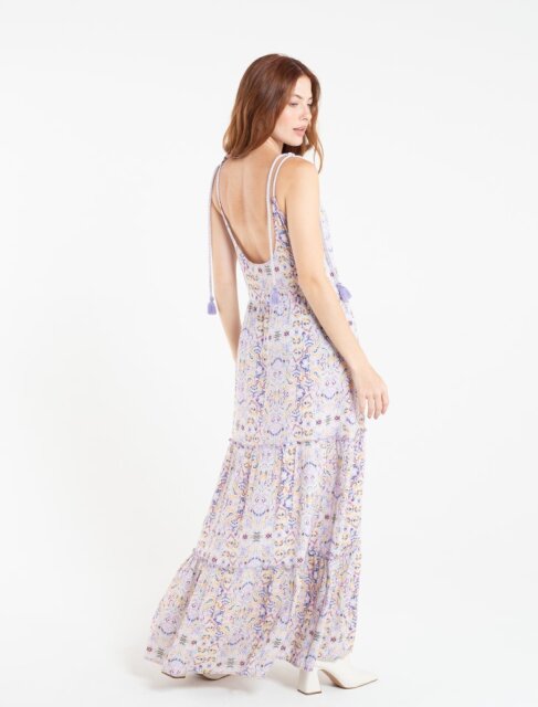 Long dress. • Round neck. • Strips with decorative tassels.