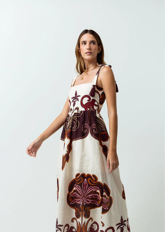 Dress with knotted straps with tassels