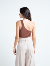 Load image into Gallery viewer, Crop-type woven shirt  • One-shoulder armhole sleeve.  • Tight silhouette.
