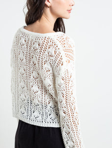 Woven sweatshirt with side openings.  • V neckline. • Decorative ties on the neck.  • Crop length.