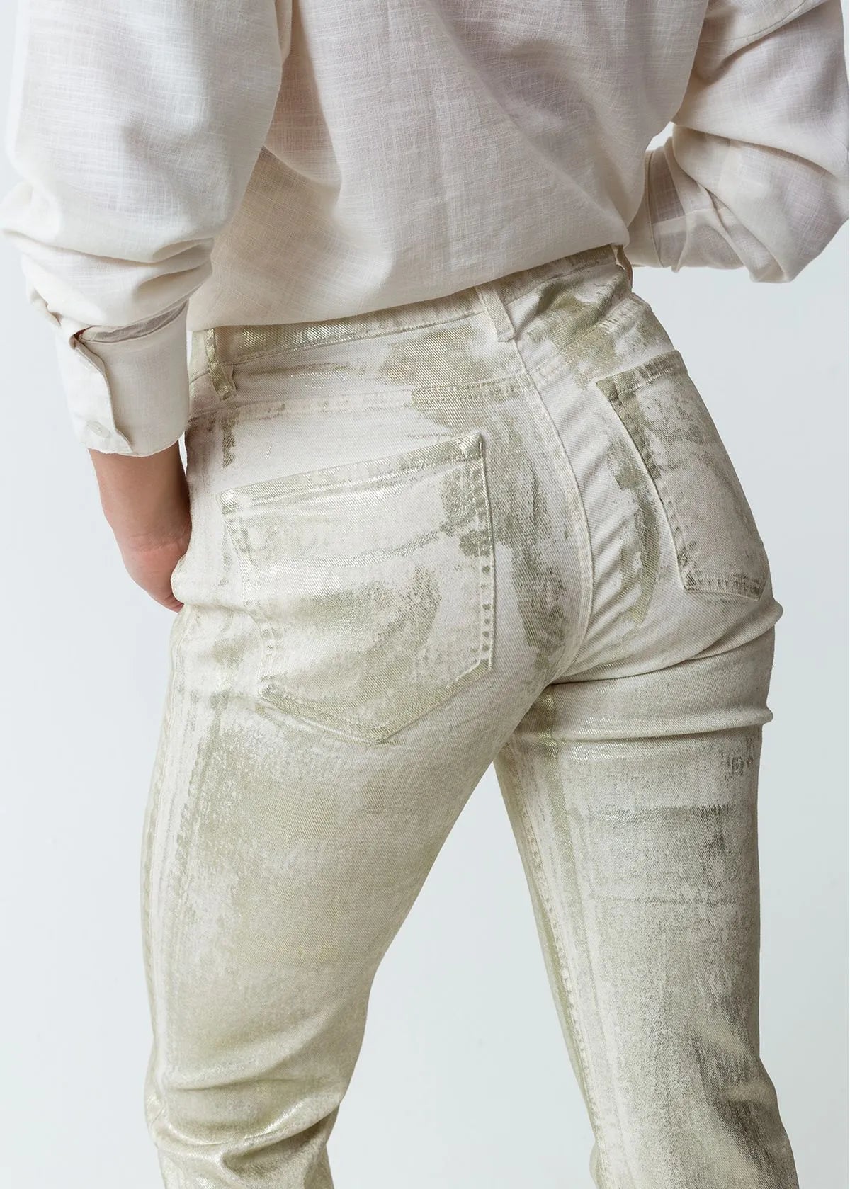 Trousers with metallic effect