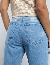 Load image into Gallery viewer, Medium tone jeans.  • High waist.  • Mom fit.  • Five pockets.  • Waistband pins.
