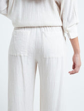 Load image into Gallery viewer, Flowy fabric pants.  • Ruffled waistband.  • Patch pockets on the front.

